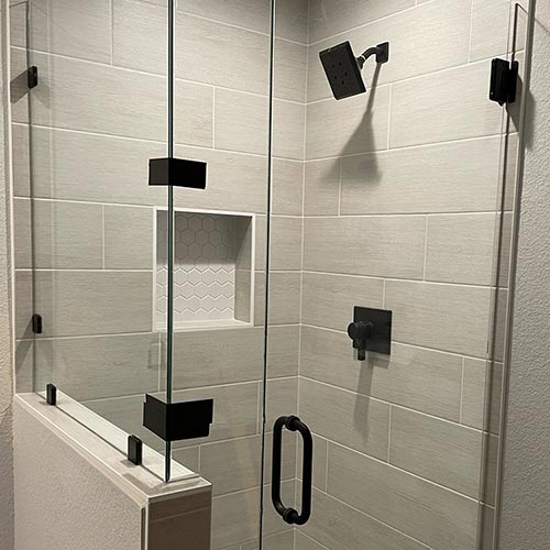 a new frameless shower enclosure installed