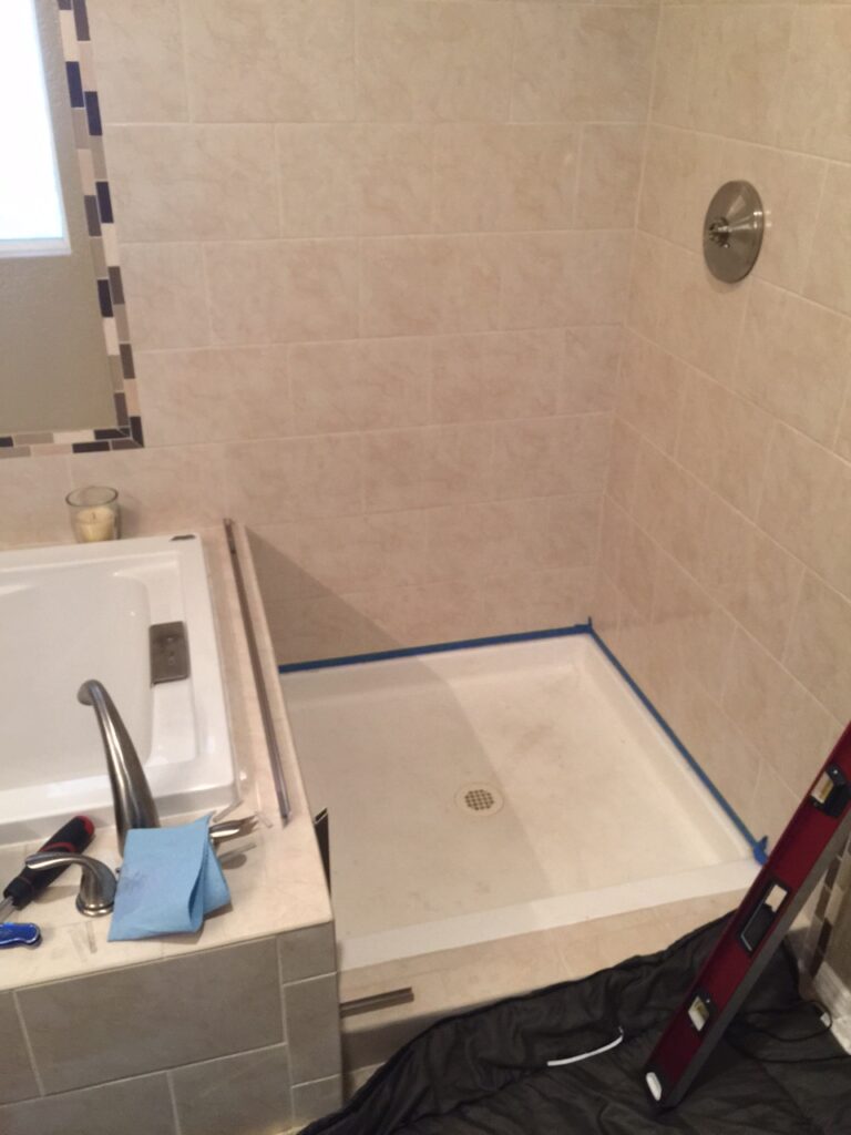 U-channel is installed for the leg and return panels in this 3-panel shower enclosure in aurora colorado